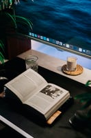 Bible, laptop, and coffee representing digital ministry work and online presence for churches and nonprofits.